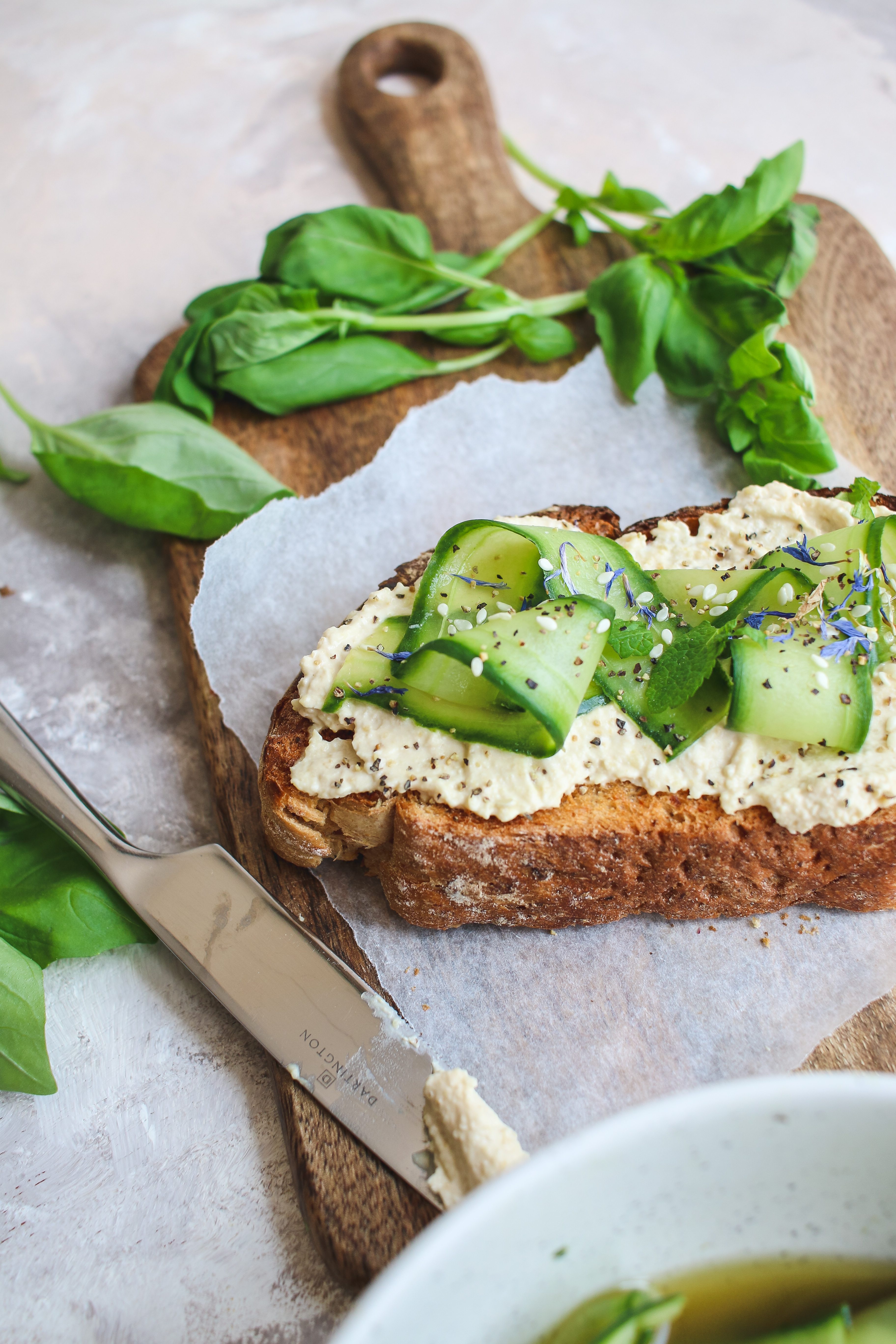 pickled cucumber and hummus toast